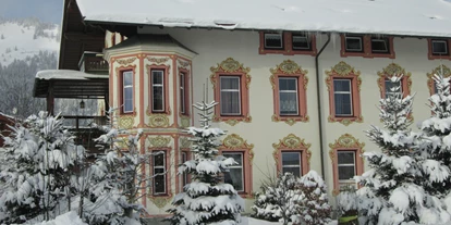 Pensionen - Terrasse - Oberndorf in Tirol - Hausansicht im Winter - Pension Florian am Park