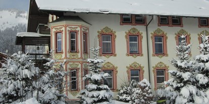 Pensionen - Art der Pension: Privatzimmervermietung - Tirol - Hausansicht im Winter - Pension Florian am Park