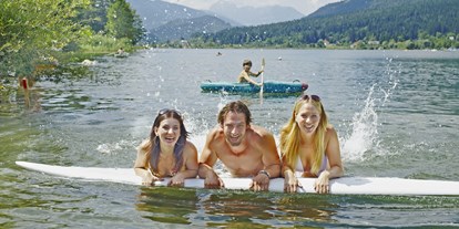 Pensionen - Skiverleih - Raßnig - Schwimmen im Presegger See - Appartement Sonja im Haus Carinthia am Nassfeld