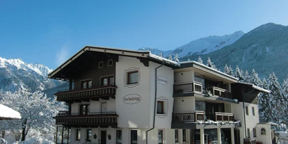 Pensionen - Wanderweg - Kirchberg in Tirol - Außenansicht Winter - Haus Dschulnigg
