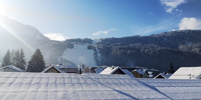 Pensionen - Sauna - Kärnten - Haus Scheiblauer Nassfeld Tröpolach skiing apartment 16 view to the slope - Haus Scheiblauer