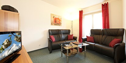 Pensionen - Umgebungsschwerpunkt: Stadt - Wängle - Junior-Suite Dreitorspitze - Wohnzimmer - Gästehaus im Winkel