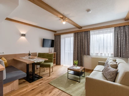 Pensionen - Kössen - Appartement Brandstadl Wohnraum - Zimmer & Appartements Pension Hinterholzer