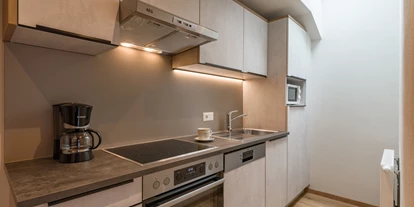 Pensionen - Parkplatz: kostenlos bei der Pension - Alpbach - Apartments mit voll ausgestatteten Küchen im Rosenhof in Mayrhofen/Zillertal. - Hotel Garni Birkenhof & Apartments Rosenhof