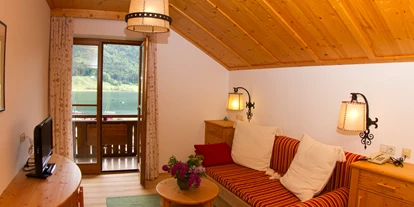 Pensionen - Restaurant - Familienzimmer Wohnzimmer - Pension Bergblick am Weissensee