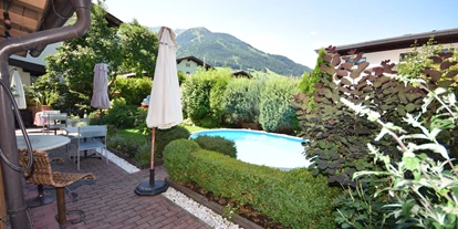 Pensionen - Parkplatz: kostenlos bei der Pension - Leogang - Garten - Golf & Ski Chalet****