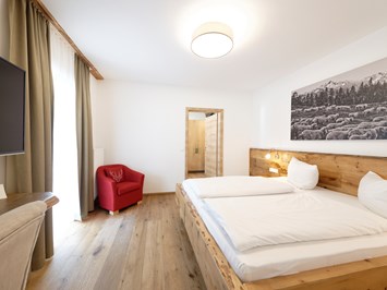 Hotel Garni Alpengruß Zimmerkategorien Vierbettzimmer mi Dachterrasse